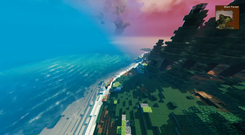 looking down a coastline from above, ocean on one side and forest on the other
